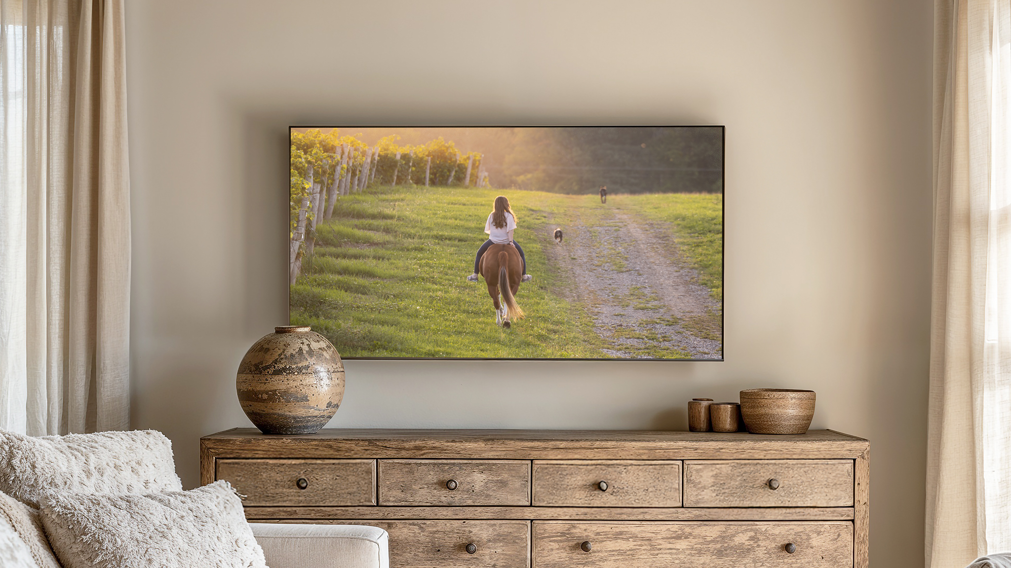 girl riding horse with dogs in vineyard in niagara