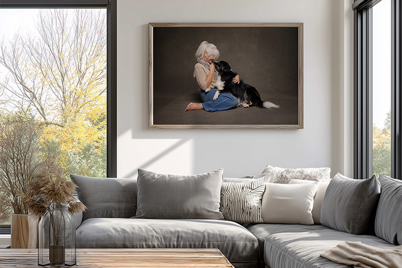 wall art featuring a woman cuddling with her dog in studio with niagara dog photographer