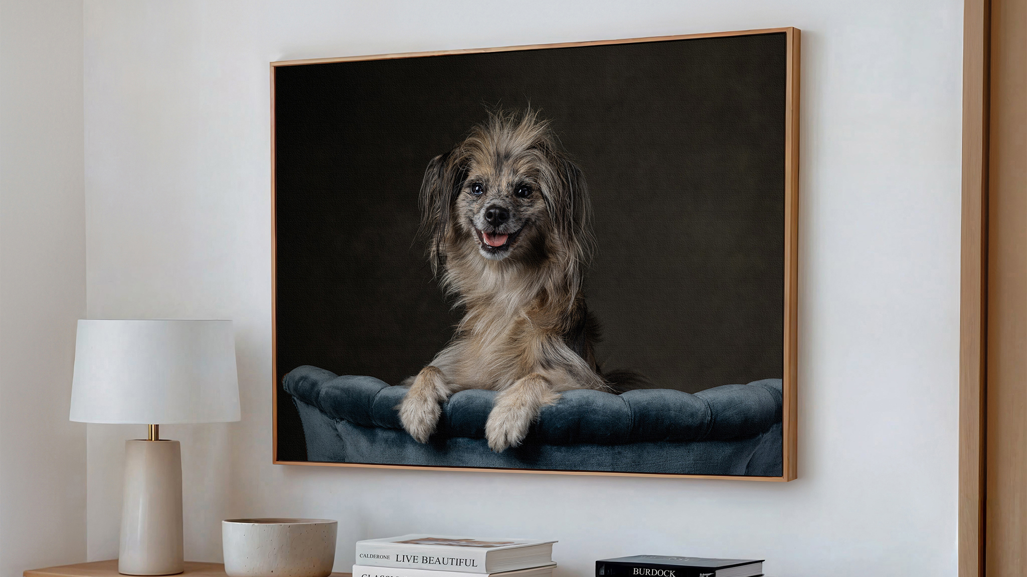 Framed portrait of a St. Catharines dog styled as wall art above a credenza